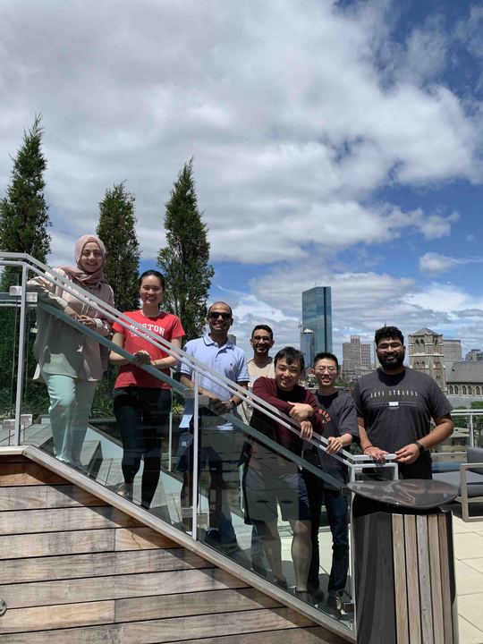 The lab on a rooftop terrace with the Boston skyline behind, June 2022